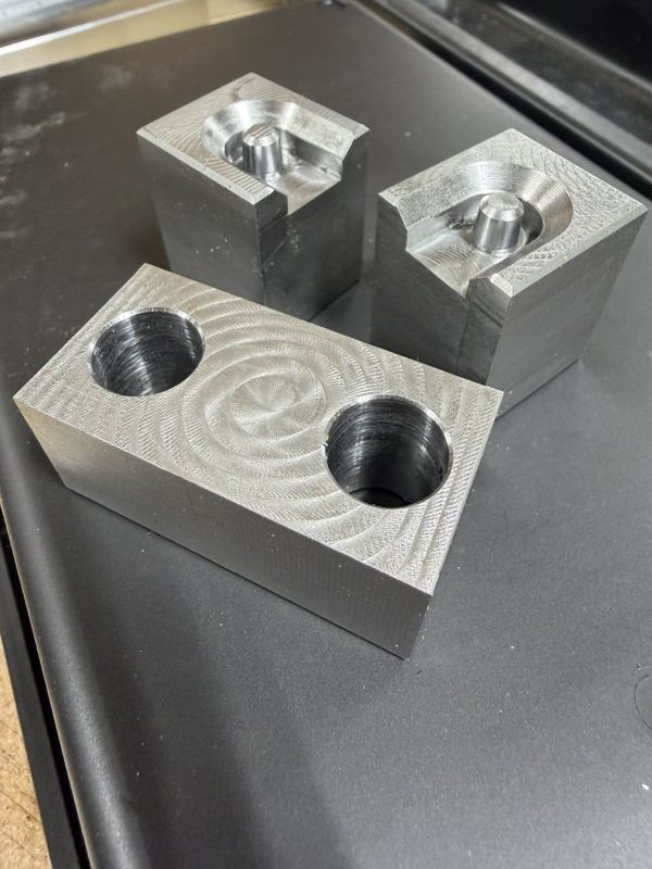 Machined blocks with counterbores and pockets, fresh off the mill